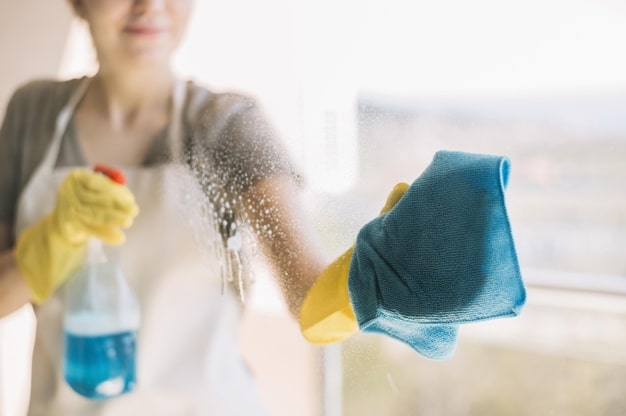 close-up-woman-cleaning-window