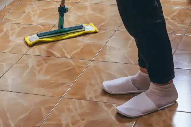 Mop the tiles to risen the floor