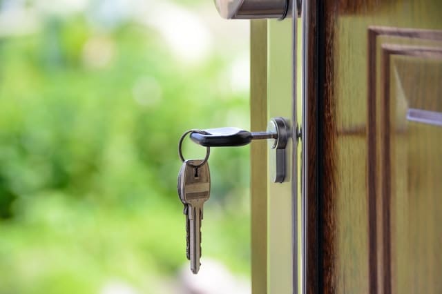 A picture of a key inside a front door