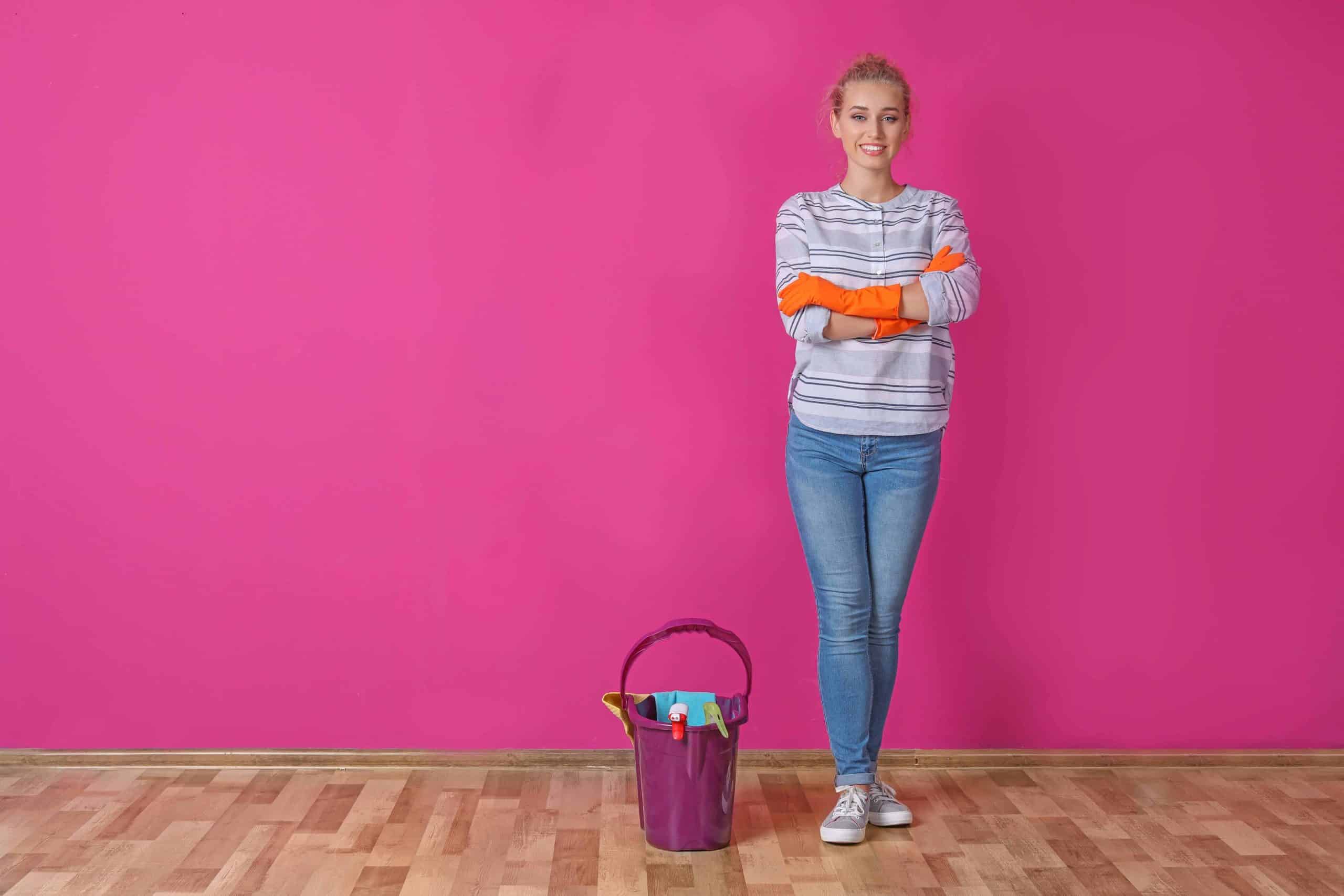 Woman standing in front of fuchsia wall
