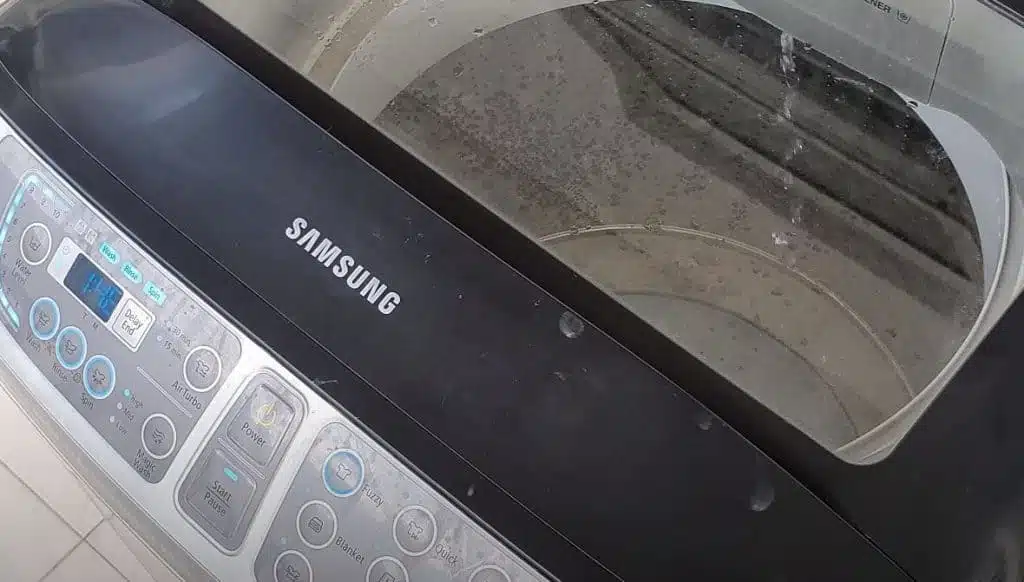 samsung top loader washing machine being cleaned
