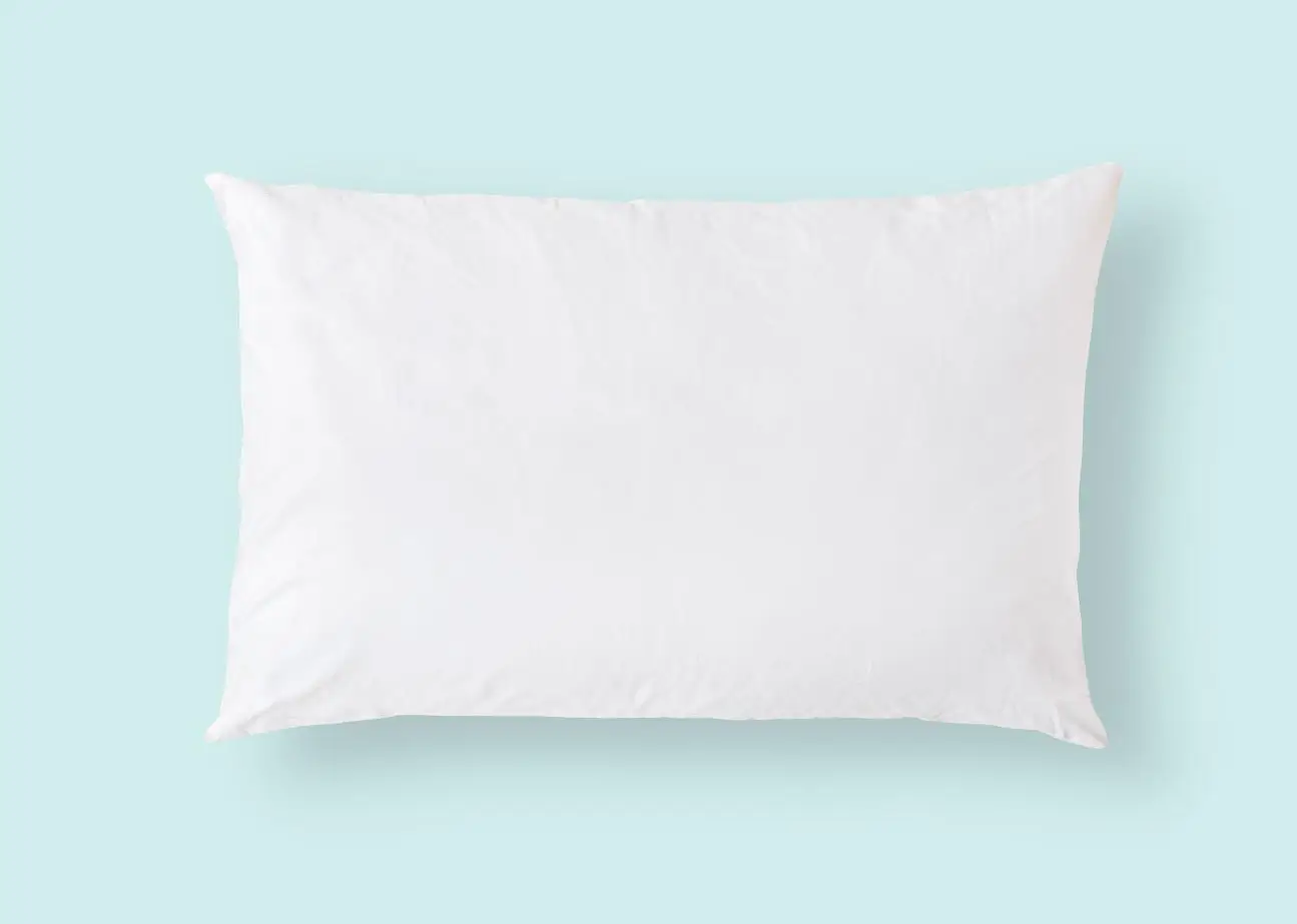 white pillow on a blue backdrop