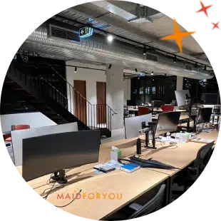 large office area with multiple monitors after being cleaned